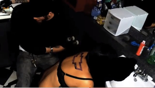 Illustration for article titled This crazy girl tattooed a ten-inch Chevy logo on her back for a free ride to SxSW